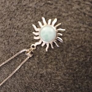 Silver and Blue Pendant Necklace with Central Stone and Sun Rays